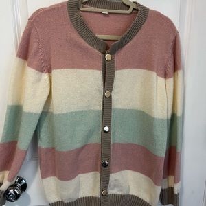 Pastel colored cardigan.  Hardly worn. Very cute!